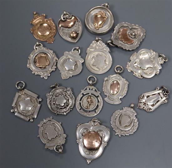 Fifteen assorted silver medallions (133 grams) and a 9ct gold medal (6.5grams).